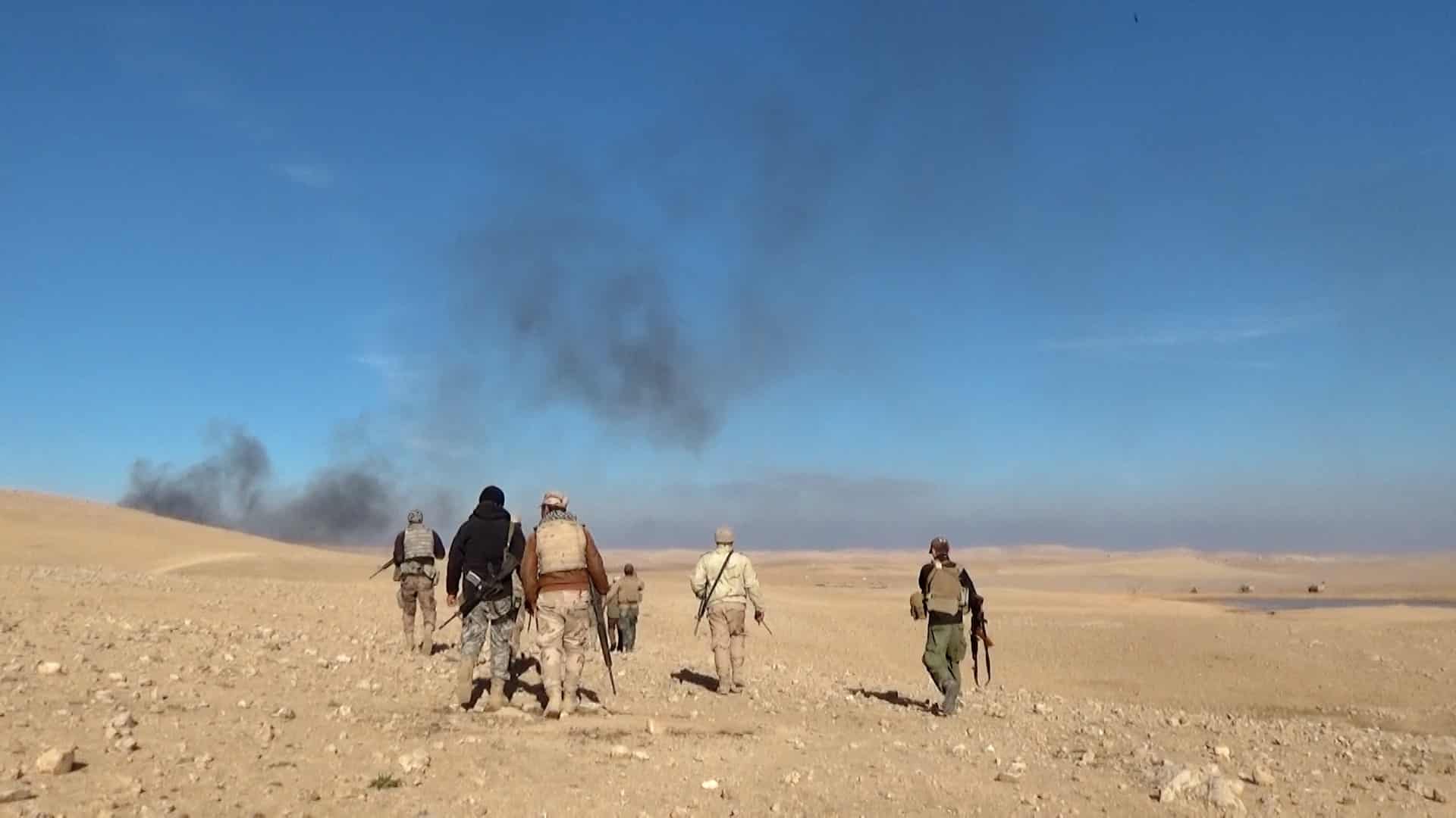 people walking in desert